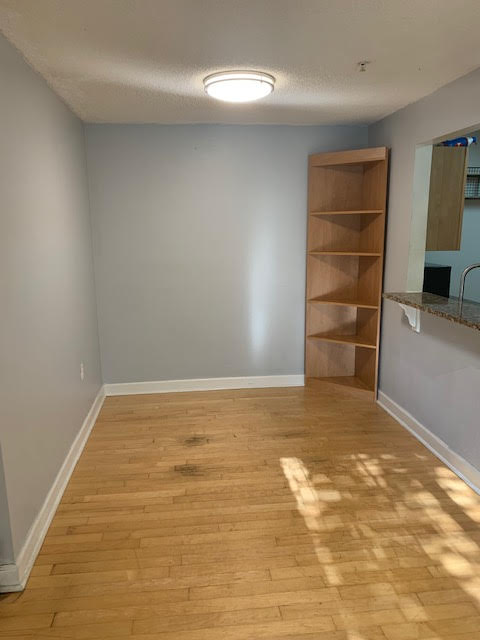 Dining area with breakfast counter into kitchen
