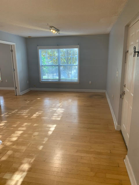 Livingroom facing the community tennis court