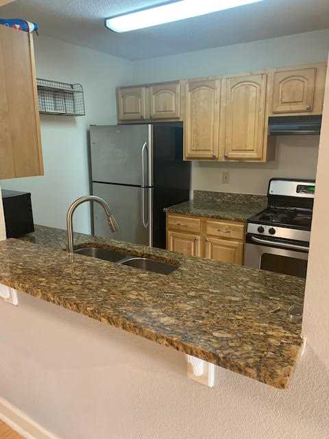 Kitchen with gas range.
